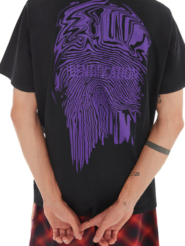 model on a relaxed pose featuring the back of black t-shirt with purple fingerprint print