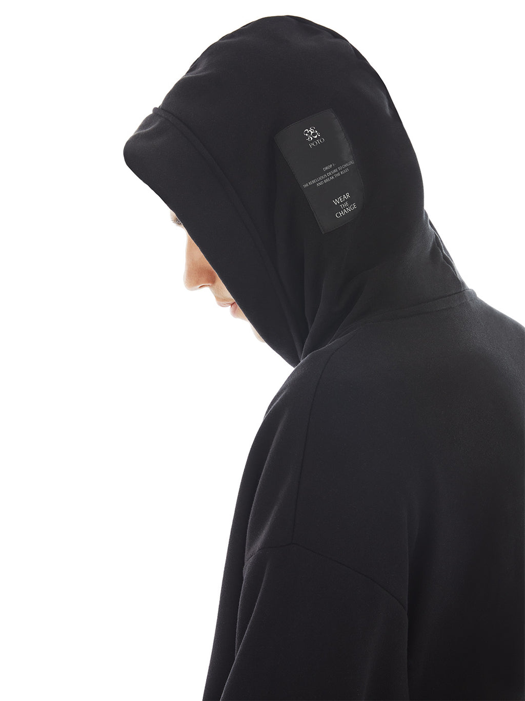hood of black poncho with brand tag on the side