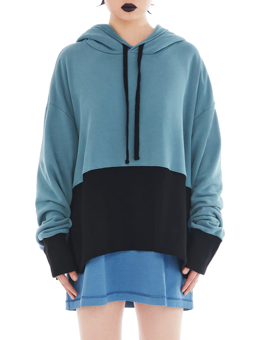 front of teal and black poncho with maxi slit on the side