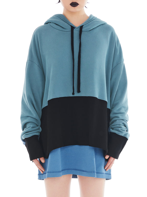 front of teal and black poncho with maxi slit on the side